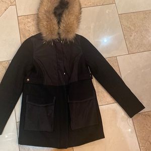 Black wool and fabric mix jacket with pockets and a hood with fur